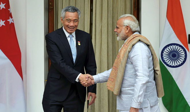 Narendra Modi shakes hand with Singapore counterpart Lee... Narendra Modi shakes hand with Singapore counterpart Lee...- India TV