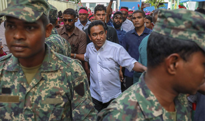 Maldivian president Yameen Abdul Gayoom, center, surrounded by his body guards | AP Photo Maldivian president Yameen Abdul Gayoom, center, surrounded by his body guards | AP Photo- India TV