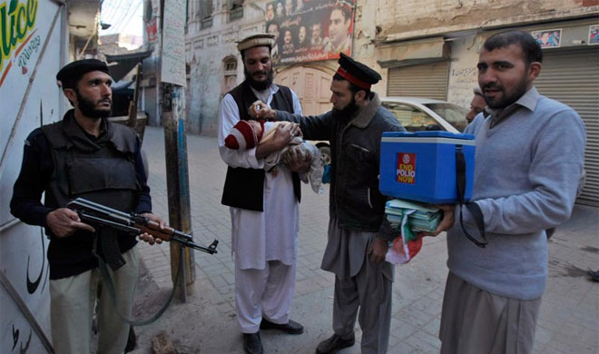 Pakistan: 2 polio workers killed in ambush in tribal region | AP Photo Pakistan: 2 polio workers killed in ambush in tribal region | AP Photo- Khabar IndiaTV