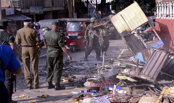 Mosque, shops attacked in anti-Muslim riots in Sri Lanka, army deployed | AP Photo Mosque, shops attacked in anti-Muslim riots in Sri Lanka, army deployed | AP Photo- India TV