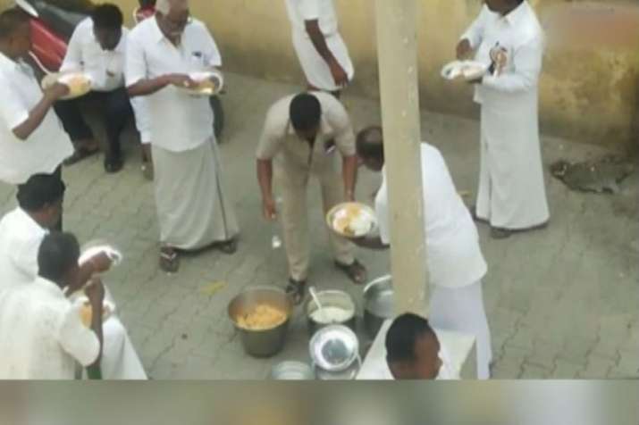 AIADMK cadres seen eating biryani, consuming liquor during one-day hunger strike AIADMK cadres seen eating biryani, consuming liquor during one-day hunger strike- India TV