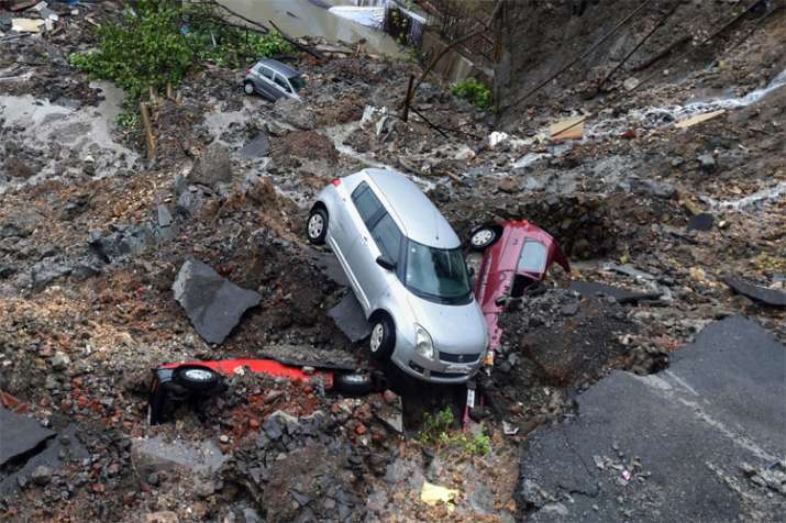 Mumbai Rains: Cars buried as wall collapses after heavy rain, trains services disrupted | PTI Mumbai Rains: Cars buried as wall collapses after heavy rain, trains services disrupted | PTI- India TV