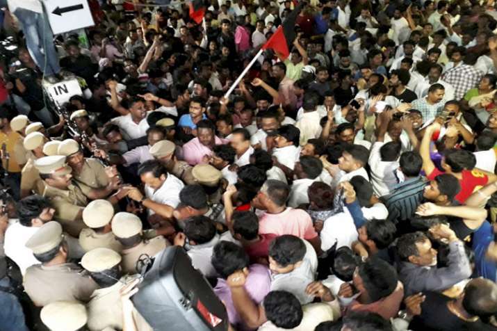 DMK supporters wait outside a private hospital, where... DMK supporters wait outside a private hospital, where...- India TV