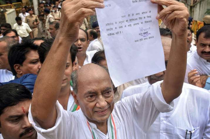 Digvijay Singh shows his clean-chit letter, obtained... Digvijay Singh shows his clean-chit letter, obtained...- India TV