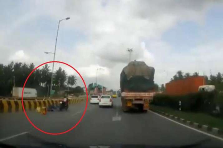 Five-year-old rides bike for 20 secs after parents get knocked off in accident, escapes unhurt Five-year-old rides bike for 20 secs after parents get knocked off in accident, escapes unhurt- India TV