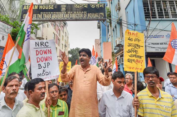 Congress activists raise slogans during a protest... Congress activists raise slogans during a protest...- India TV