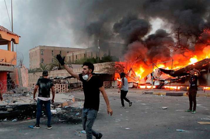 Iraq: 12 dead in Basra as rockets fired at airport and Iranian consulate torched | AP Iraq: 12 dead in Basra as rockets fired at airport and Iranian consulate torched | AP- India TV