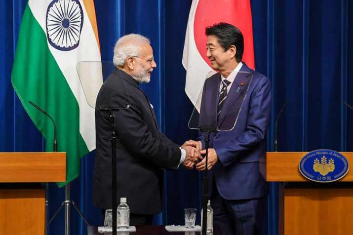Prime Minister Narendra Modi shakes hands with his... Prime Minister Narendra Modi shakes hands with his...- India TV Paisa