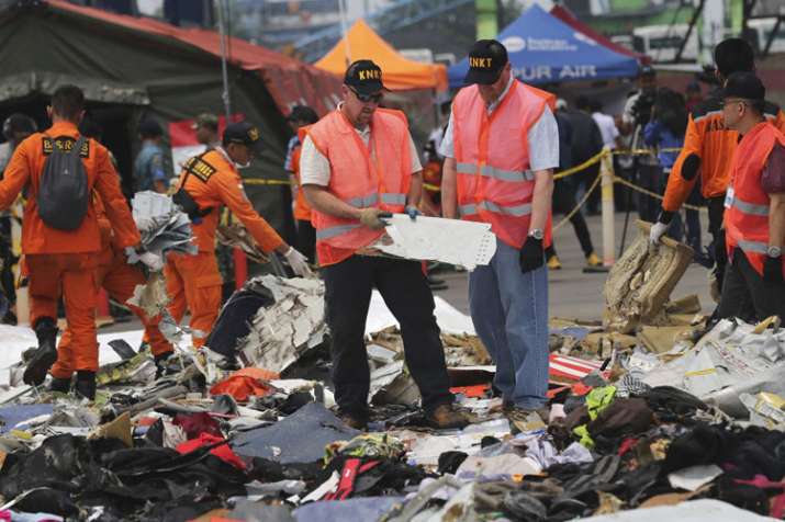 Investigators examine parts of a Lion Air jet that... Investigators examine parts of a Lion Air jet that...- India TV