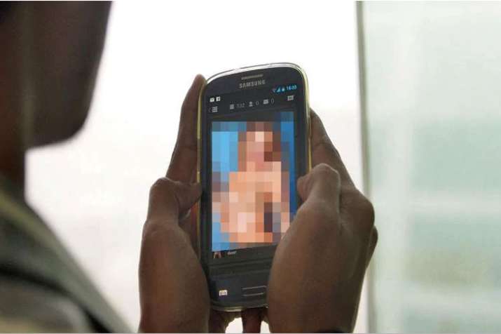 Officer booked for uploading obscene photos of wife... Officer booked for uploading obscene photos of wife...- India TV