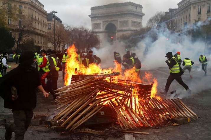 French President Emmanuel Macron to hold crisis meeting following Paris riots | AP French President Emmanuel Macron to hold crisis meeting following Paris riots | AP- India TV