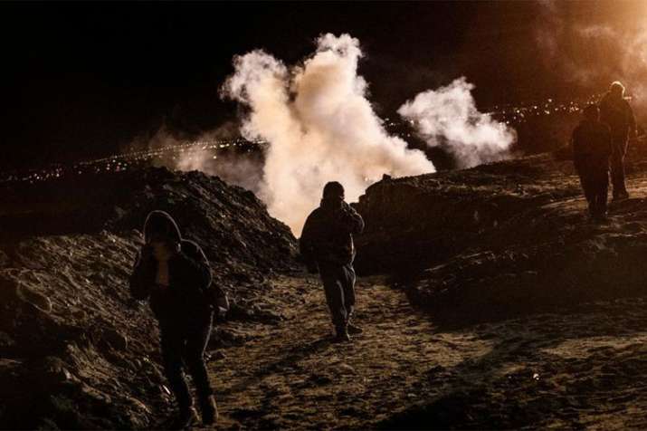 United States fires tear gas into Mexico as migrants attempt to cross border | AP Photo United States fires tear gas into Mexico as migrants attempt to cross border | AP Photo- India TV
