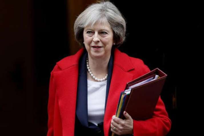 Theresa May survives confidence vote, says MPs must 'work together' to deliver Brexit | AP File Theresa May survives confidence vote, says MPs must 'work together' to deliver Brexit | AP File- India TV