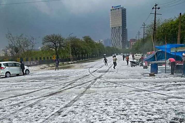 A view of a street after hailstorm struck various parts... A view of a street after hailstorm struck various parts...- India TV