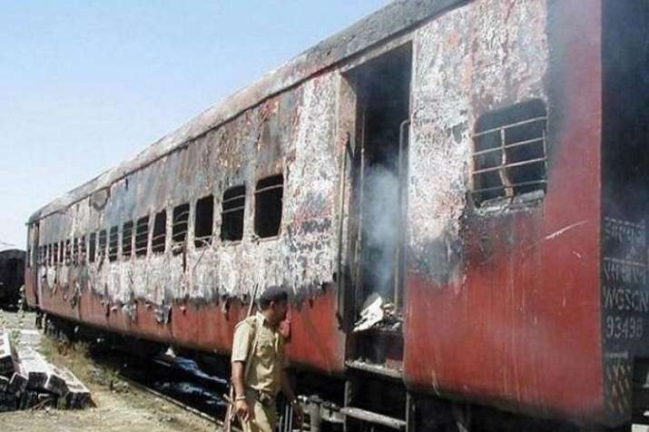 Coach S6 of the Sabarmati Express that was burnt on... Coach S6 of the Sabarmati Express that was burnt on...- India TV