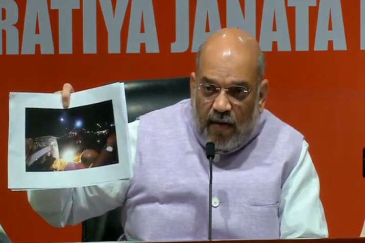 BJP National President Amit Shah during an election roadshow in Kolkata BJP National President Amit Shah during an election roadshow in Kolkata- India TV