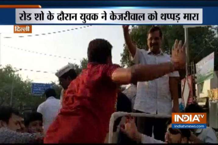 Delhi CM Arvind Kejriwal assaulted by a man during his road show Delhi CM Arvind Kejriwal assaulted by a man during his road show- India TV