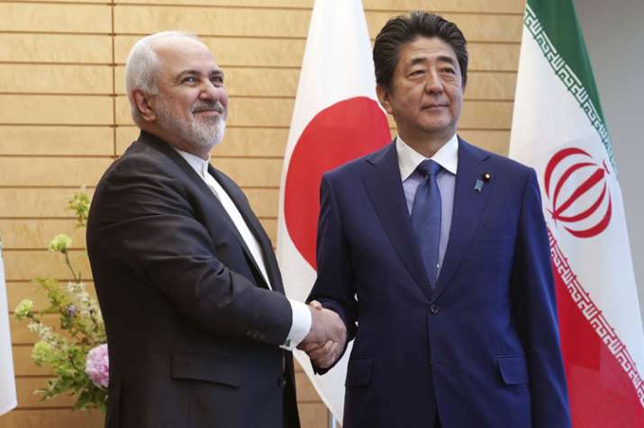 Iranian Foreign Minister Mohammad Javad Zarif and Japanese Prime Minister Shinzo Abe shake hands Iranian Foreign Minister Mohammad Javad Zarif and Japanese Prime Minister Shinzo Abe shake hands - India TV