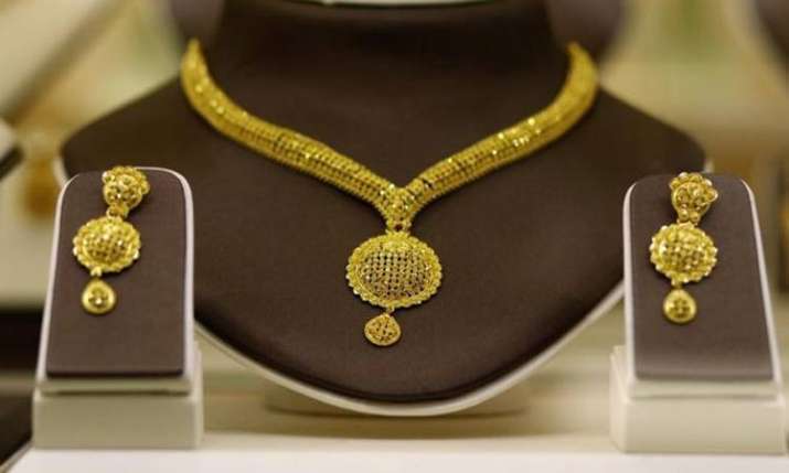 Gold remains flat; silver slides on reduced offtake Gold remains flat; silver slides on reduced offtake- India TV Paisa
