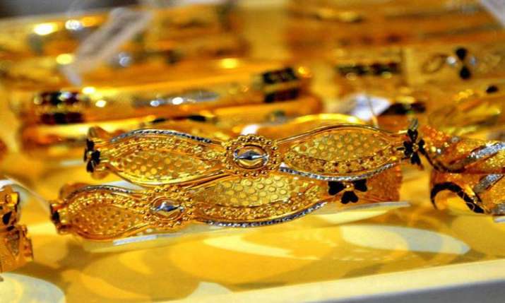 Gold glitters, jumps Rs 200 amid positive global market Gold glitters, jumps Rs 200 amid positive global market- India TV Paisa
