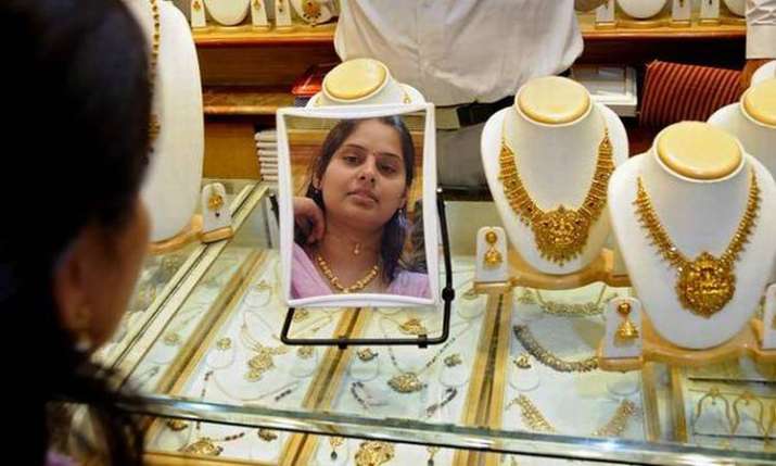 Gold, silver slide on easing demand Gold, silver slide on easing demand- India TV Paisa