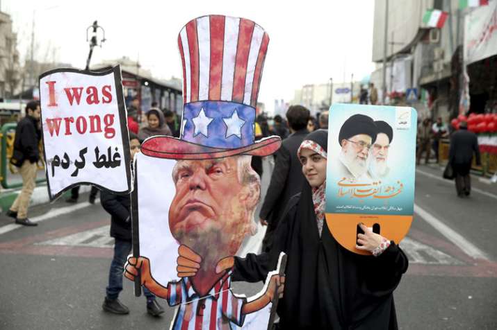 An Iranian woman holds an effigy of US president Donald Trump | AP File An Iranian woman holds an effigy of US president Donald Trump | AP File- India TV