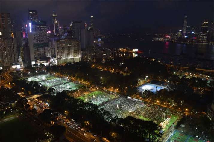 Thousands of people attend a candlelight vigil for... Thousands of people attend a candlelight vigil for...- India TV
