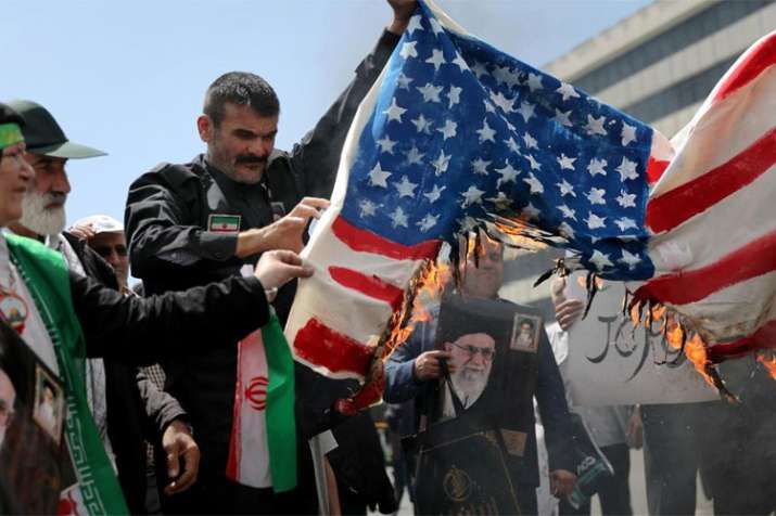 Protesters burn a US flag during a rally in Tehran| AP File Protesters burn a US flag during a rally in Tehran| AP File- India TV