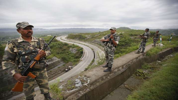 CRPF personnel stand guard on Jammu-Srinagar national... CRPF personnel stand guard on Jammu-Srinagar national...- India TV