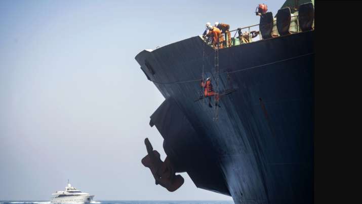 Gibraltar: Crew members of the Grace 1 super tanker remove the name of ship in the British territory Gibraltar: Crew members of the Grace 1 super tanker remove the name of ship in the British territory- India TV
