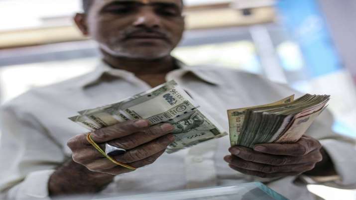 Rupee tumbles 68 paise against US dollar on crude oil woes Rupee tumbles 68 paise against US dollar on crude oil woes- India TV Paisa