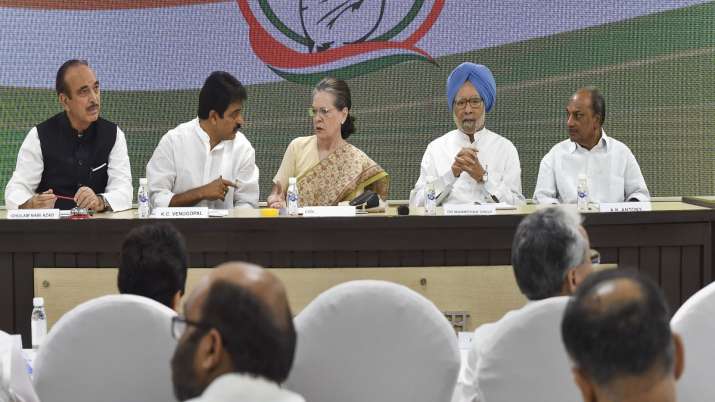Congress interim president Sonia Gandhi, flanked by... Congress interim president Sonia Gandhi, flanked by...- India TV