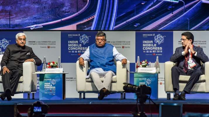Union Telecom Minister Ravi Shankar Prasad flanked by Telecom Secretary Anshu Prakash (L) and Aditya Union Telecom Minister Ravi Shankar Prasad flanked by Telecom Secretary Anshu Prakash (L) and Aditya- India TV Paisa