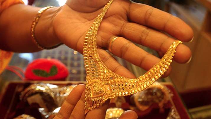 Gold slips by Rs 95 on stronger rupee, weak demand Gold slips by Rs 95 on stronger rupee, weak demand- India TV Paisa